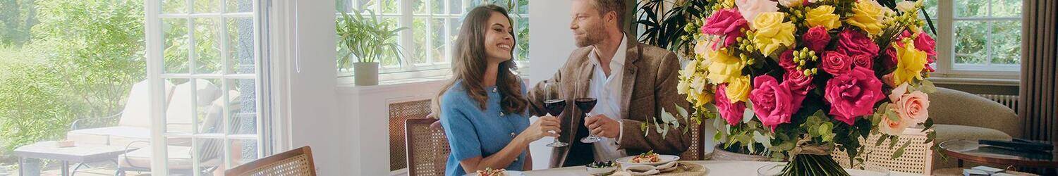 couple, dining, flowers, wine, tableware