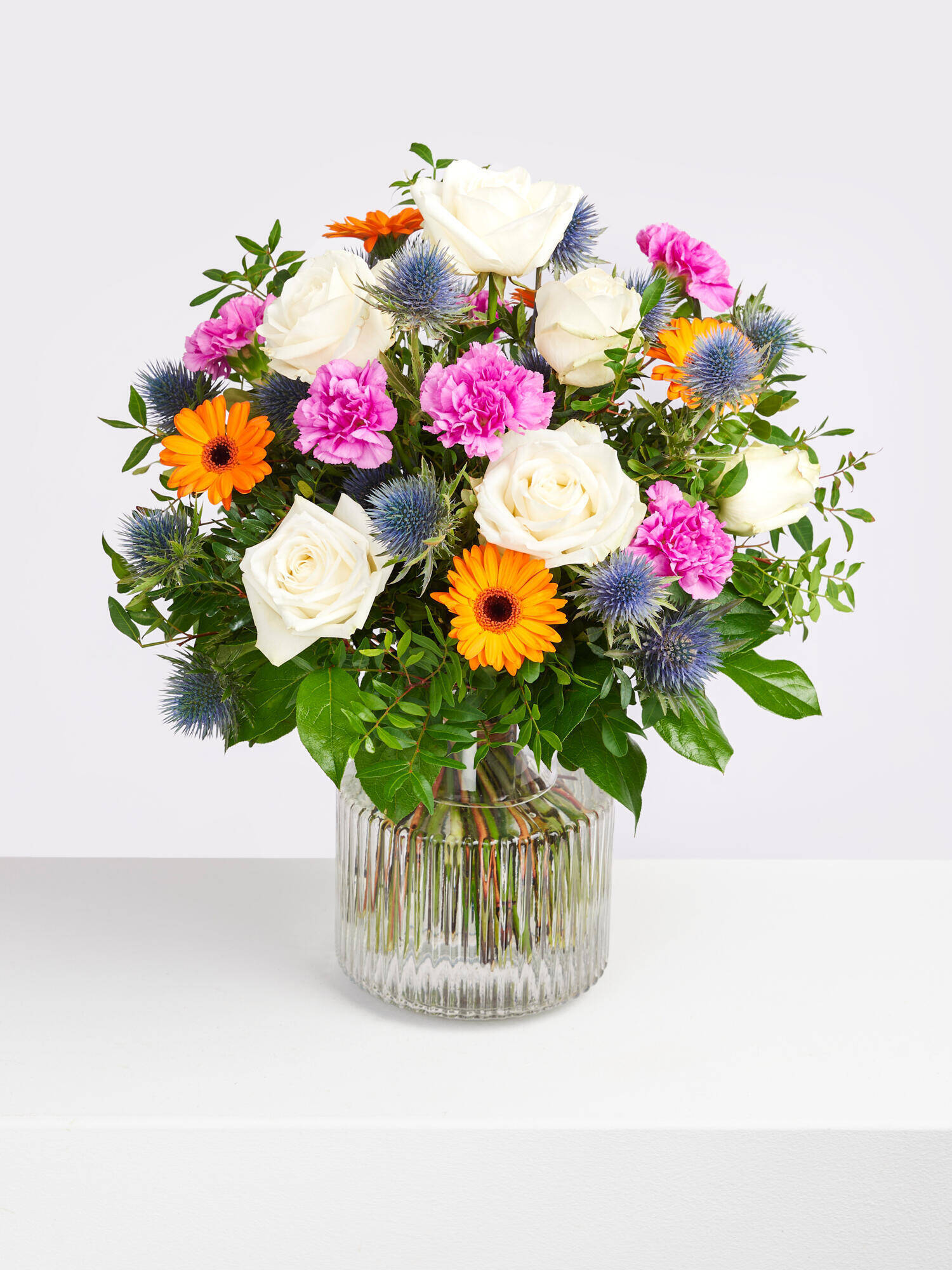 A Thousand Thanks - Main Colors: BLUE, ORANGE, PINK, WHITE - Main Flowers: CARNATIONS, GERBERA, ROSES