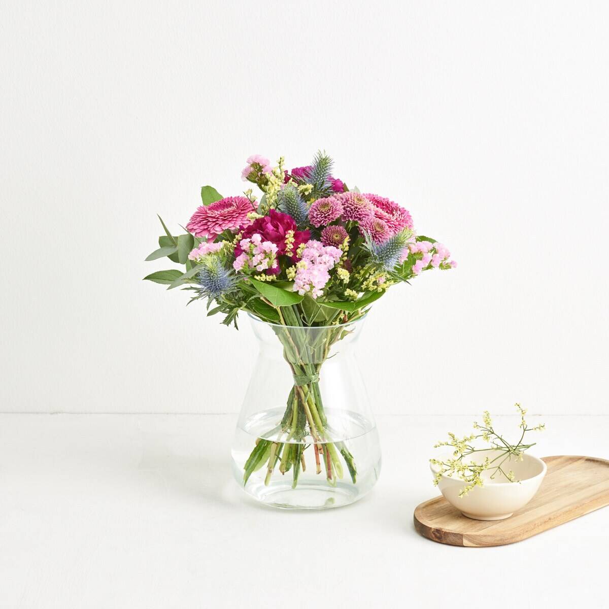 flower bouquet, pink flowers, glass vase, stems, green foliage