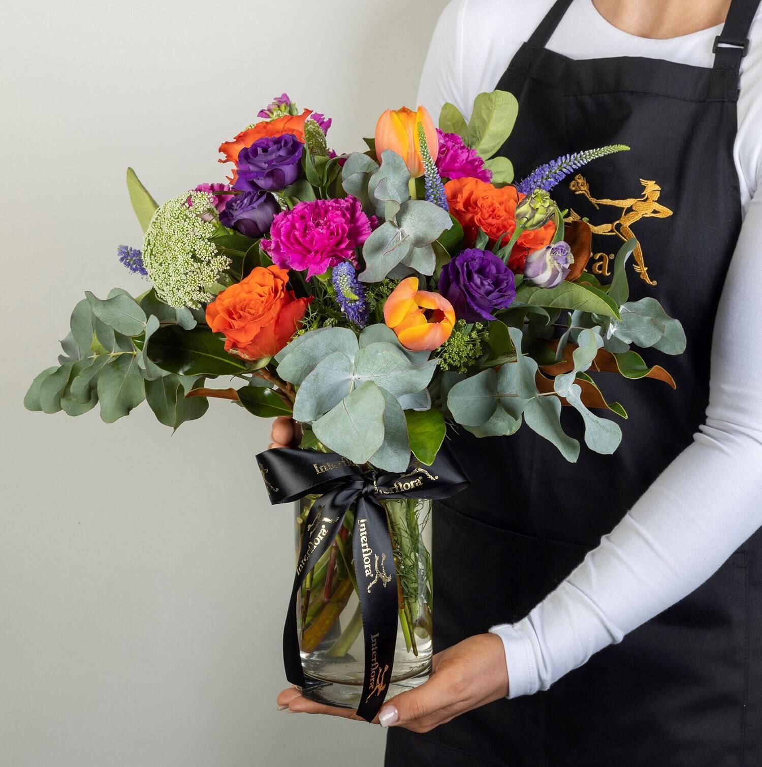 flower bouquet, mixed flowers, greenery, glass vase, ribbon bow, flower bouquet, mixed flowers, orange purple bouquet, eucalyptus, glass vase, bouquet, floral, flowers, gladiolus, eucalyptus, bouquet, flowers, arrangement, roses, greens